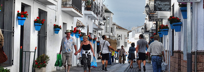 Tourists shopping in Mijas street, Costa del Sol Spain
